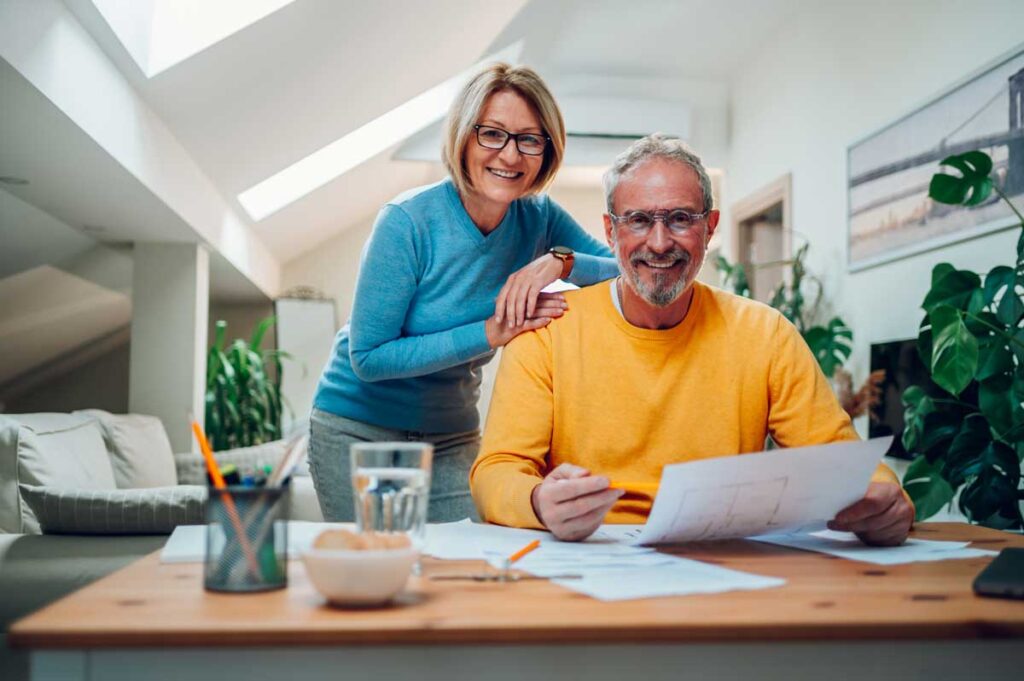 couple reviewing kitchen remodel budget and plans